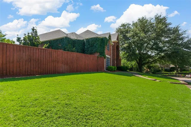 a view of a backyard with green space
