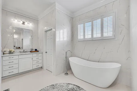 a kitchen with stainless steel appliances granite countertop a refrigerator a stove top oven a sink and cabinets