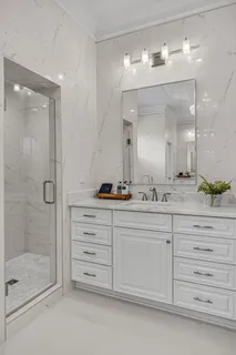 a kitchen with stainless steel appliances kitchen island granite countertop wooden cabinets and a granite counter tops