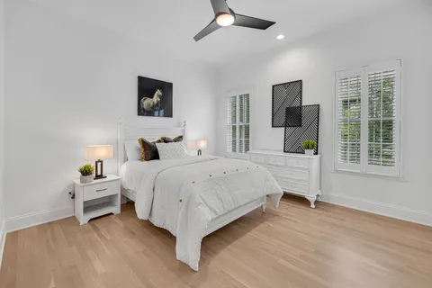 a view of kitchen with kitchen island wooden floor and center island