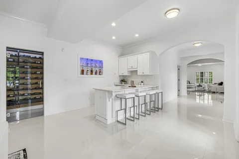 a view of a grassy field with trees