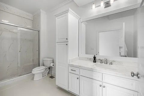 a view of a patio with table and chairs and potted plants