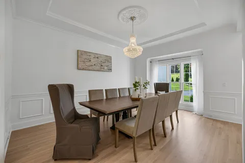a living room with a couch and chandelier