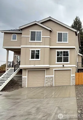 a front view of a house with a garage
