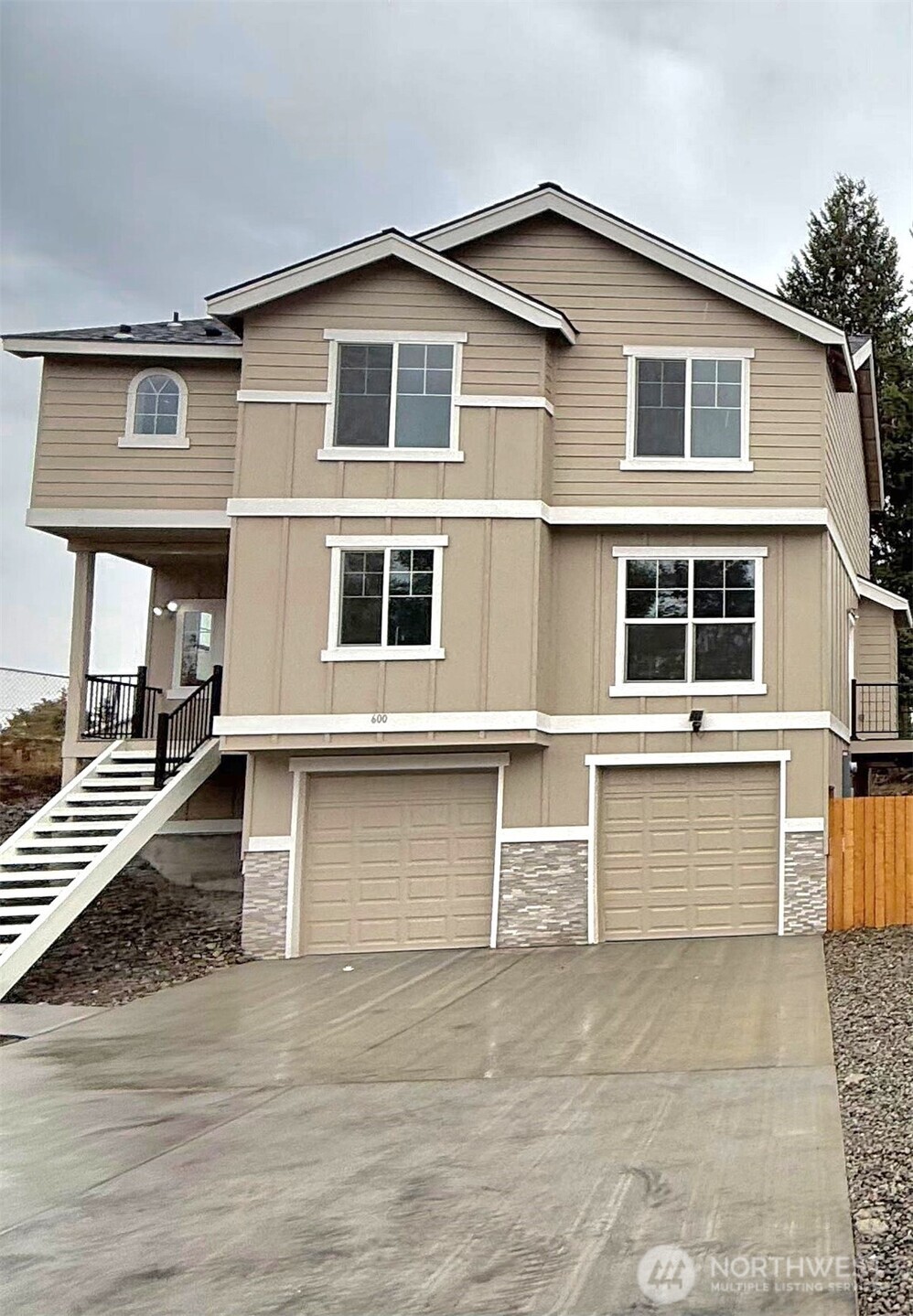 a front view of a house with a garage