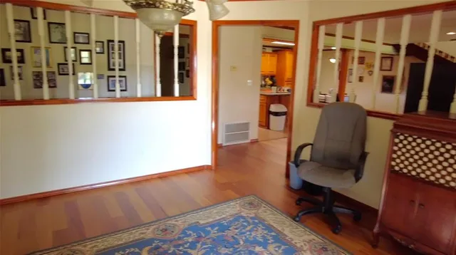 a view of wooden floor in a living room
