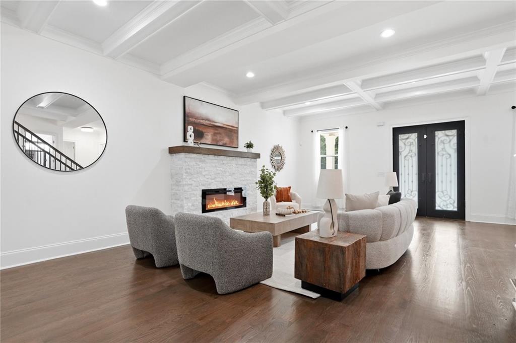 2415 West Rugby Avenue Atlanta, GA 30337 - Photo 5 of 40 a living room with furniture and a fireplace