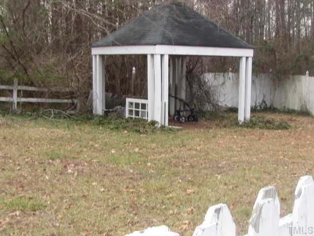2579 Burton Road Durham, NC 27704 - Photo 13 of 14 a view of a small house with backyard