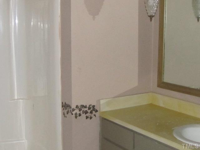 2579 Burton Road Durham, NC 27704 - Photo 8 of 14 a bathroom with a bathtub