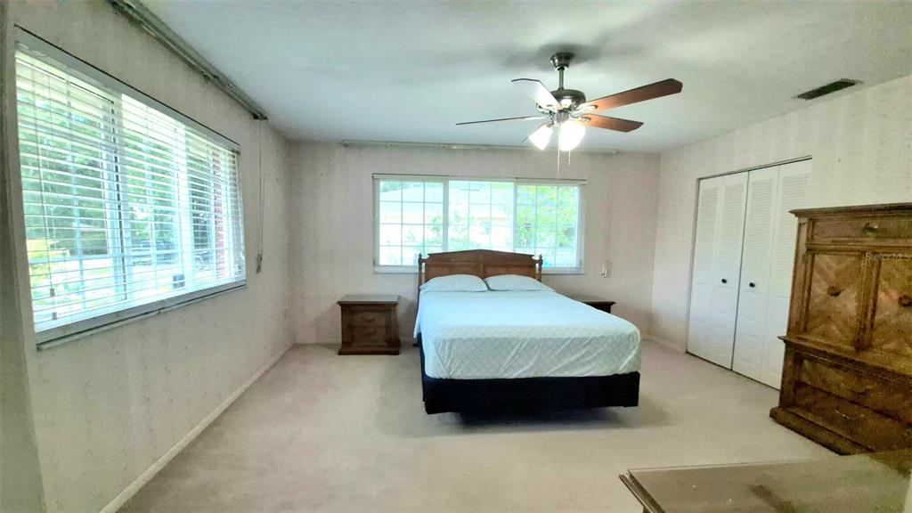 25632 Southwest 19 Avenue Newberry, FL 32669 - Photo 12 of 20 a bedroom with a bed and window