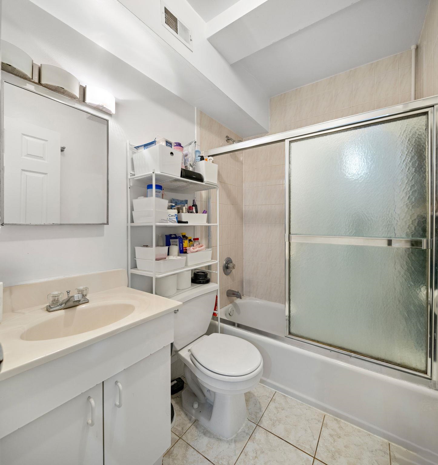 131 Clinton Street, Unit 1 Hoboken, NJ 07030 - Photo 11 of 13 a bathroom with a sink toilet and shower
