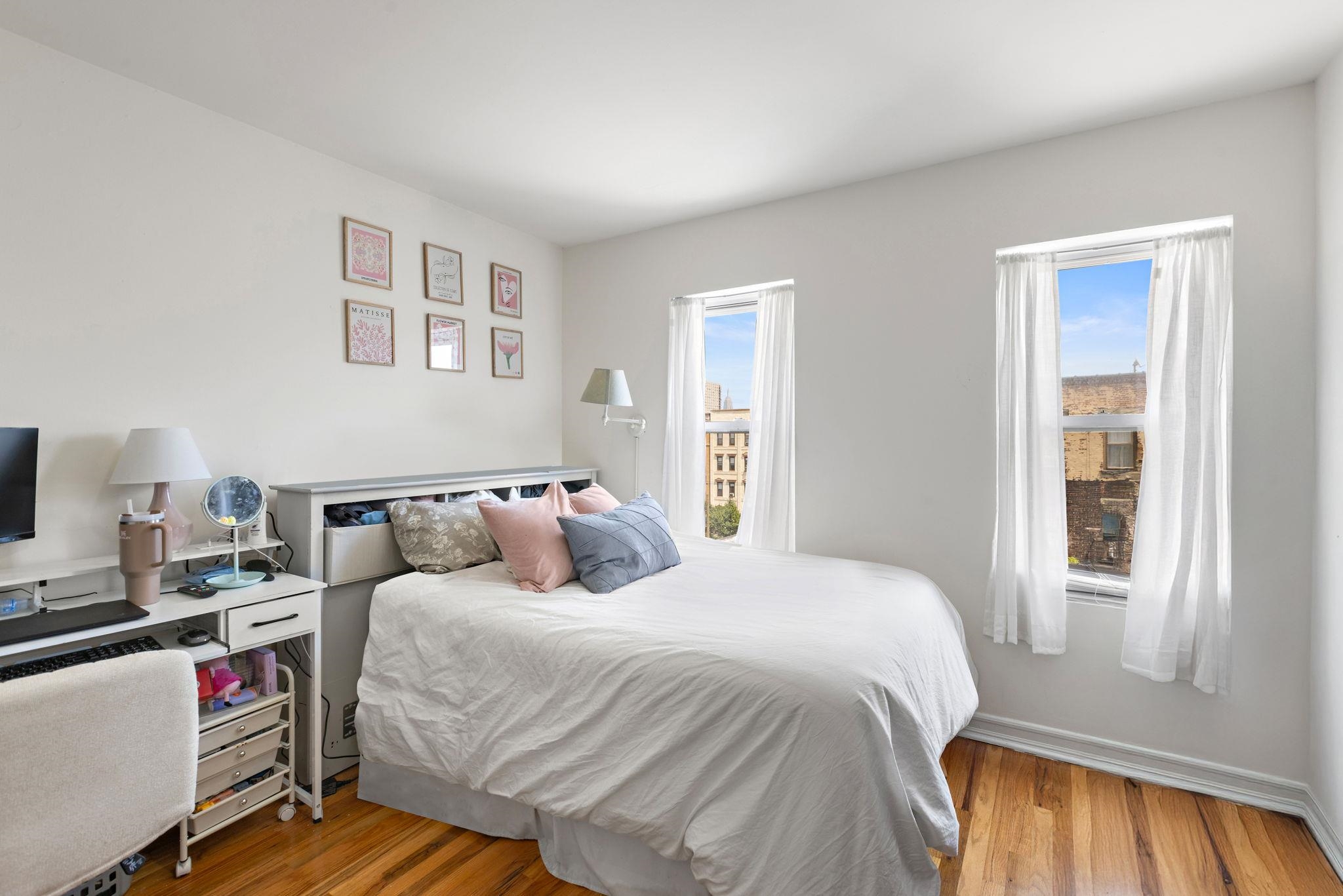 131 Clinton Street, Unit 1 Hoboken, NJ 07030 - Photo 7 of 13 a bed room with a bed and a window