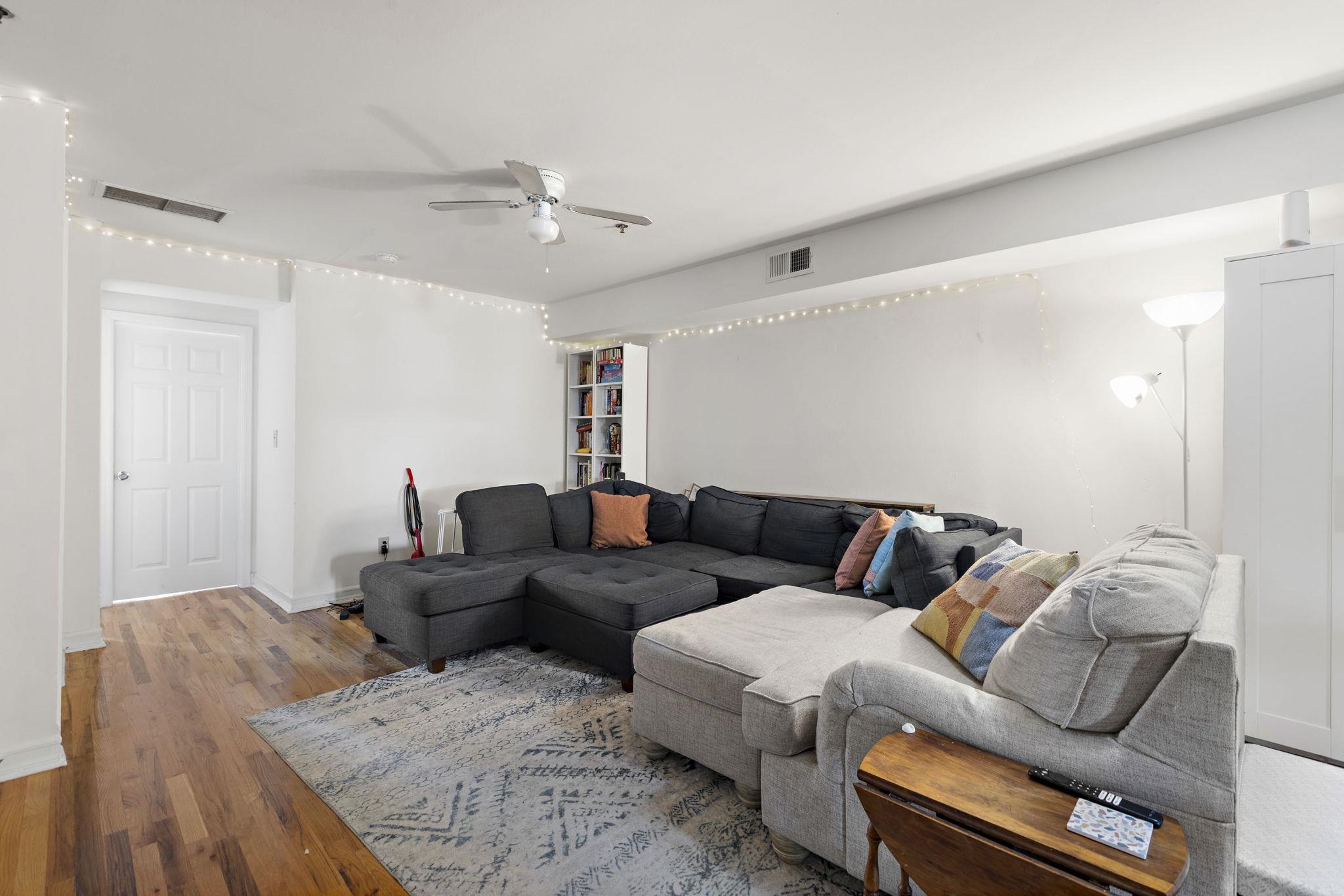 131 Clinton Street, Unit 1 Hoboken, NJ 07030 - Photo 9 of 13 a living room with furniture