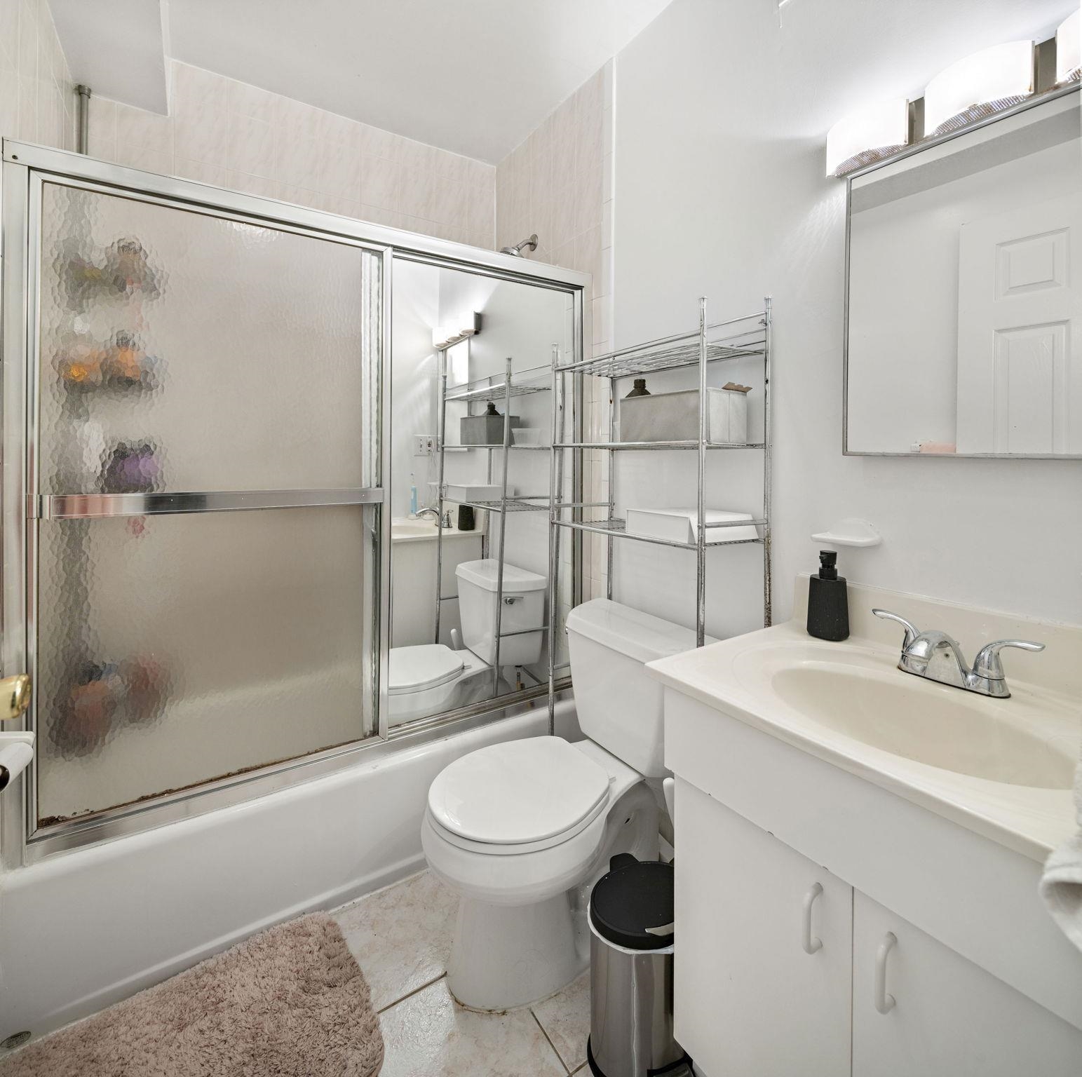 131 Clinton Street, Unit 1 Hoboken, NJ 07030 - Photo 10 of 13 a bathroom with a sink toilet and shower