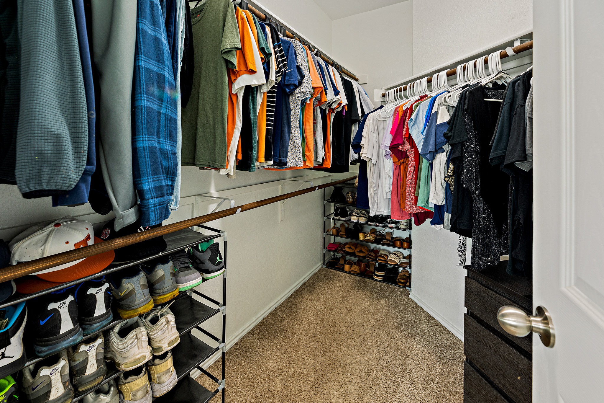 382 Limerick Road Buda, TX 78610 - Photo 12 of 20 Ample hanging space and integrated shoe storage maximize organization within this convenient walk-in closet.