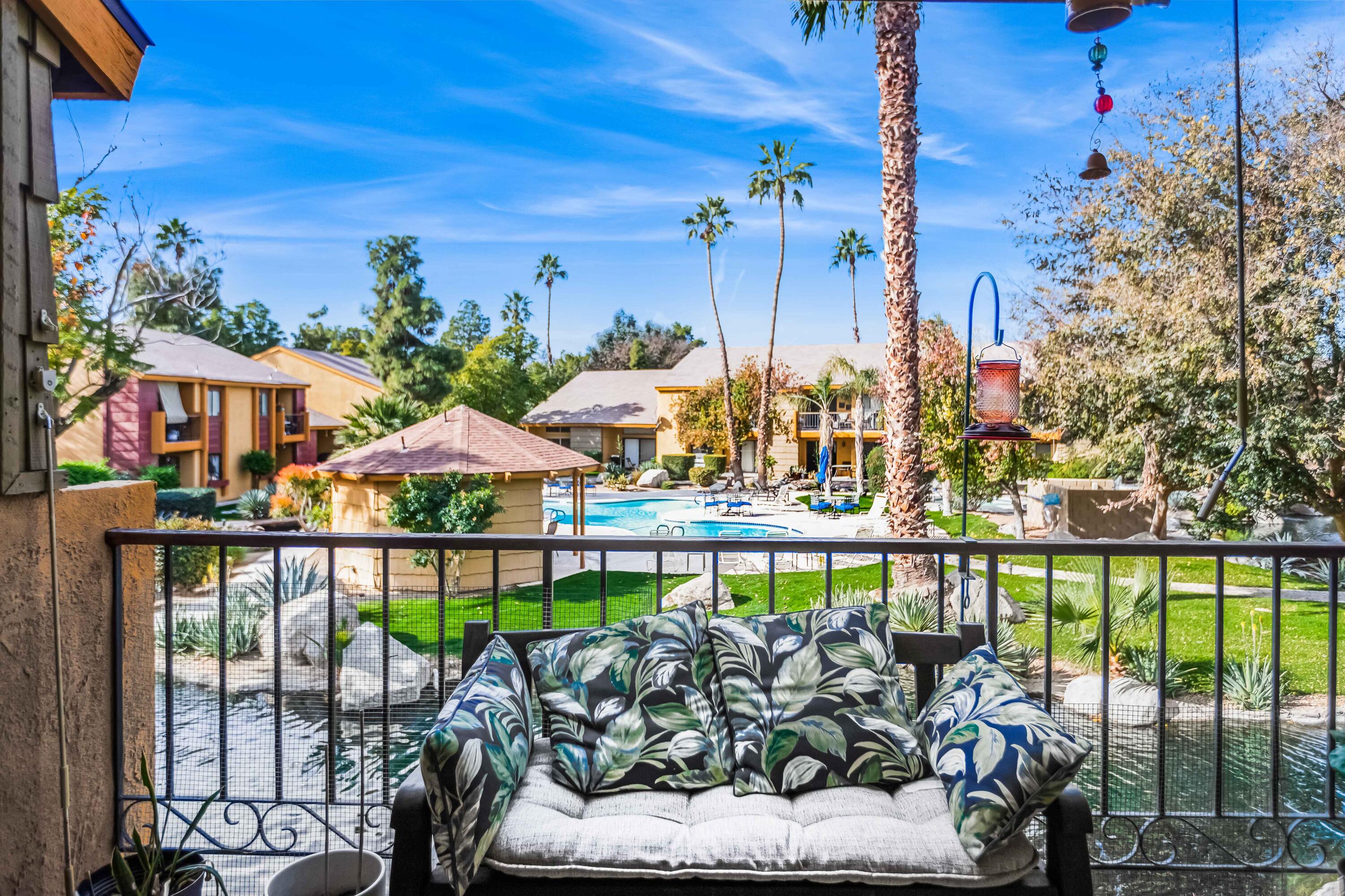 a view of a chairs and table in patio