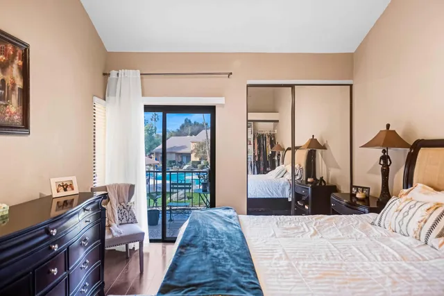 a bed room with a bed and a dresser