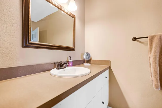 a bathroom with a sink and a mirror