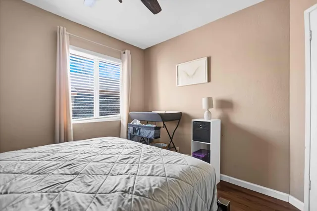 a bedroom with a bed and a table in it