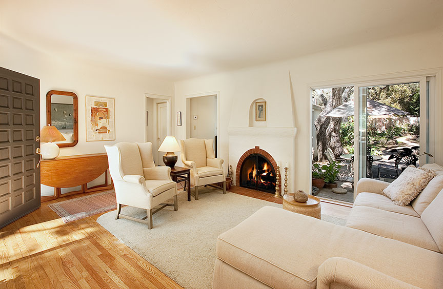 2180 East Valley Road Santa Barbara, CA 93108 - Photo 7 of 10 a living room with furniture a fireplace and a large window