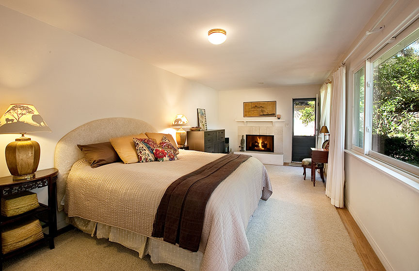 2180 East Valley Road Santa Barbara, CA 93108 - Photo 8 of 10 a bedroom with a bed and wooden floor