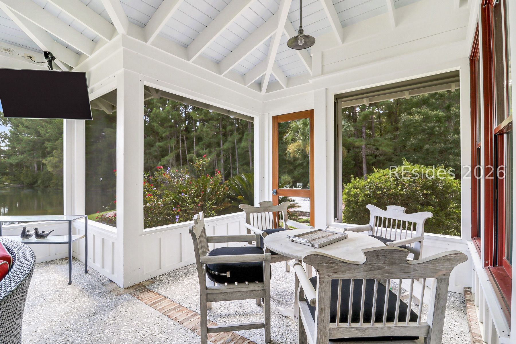 165 Golda Drive Ridgeland, SC 29936 - Photo 46 of 100 Screened Porch overlooking Pool/Lake