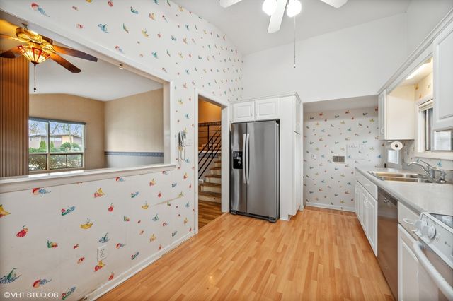 a bathroom with a sink a large mirror and a shower