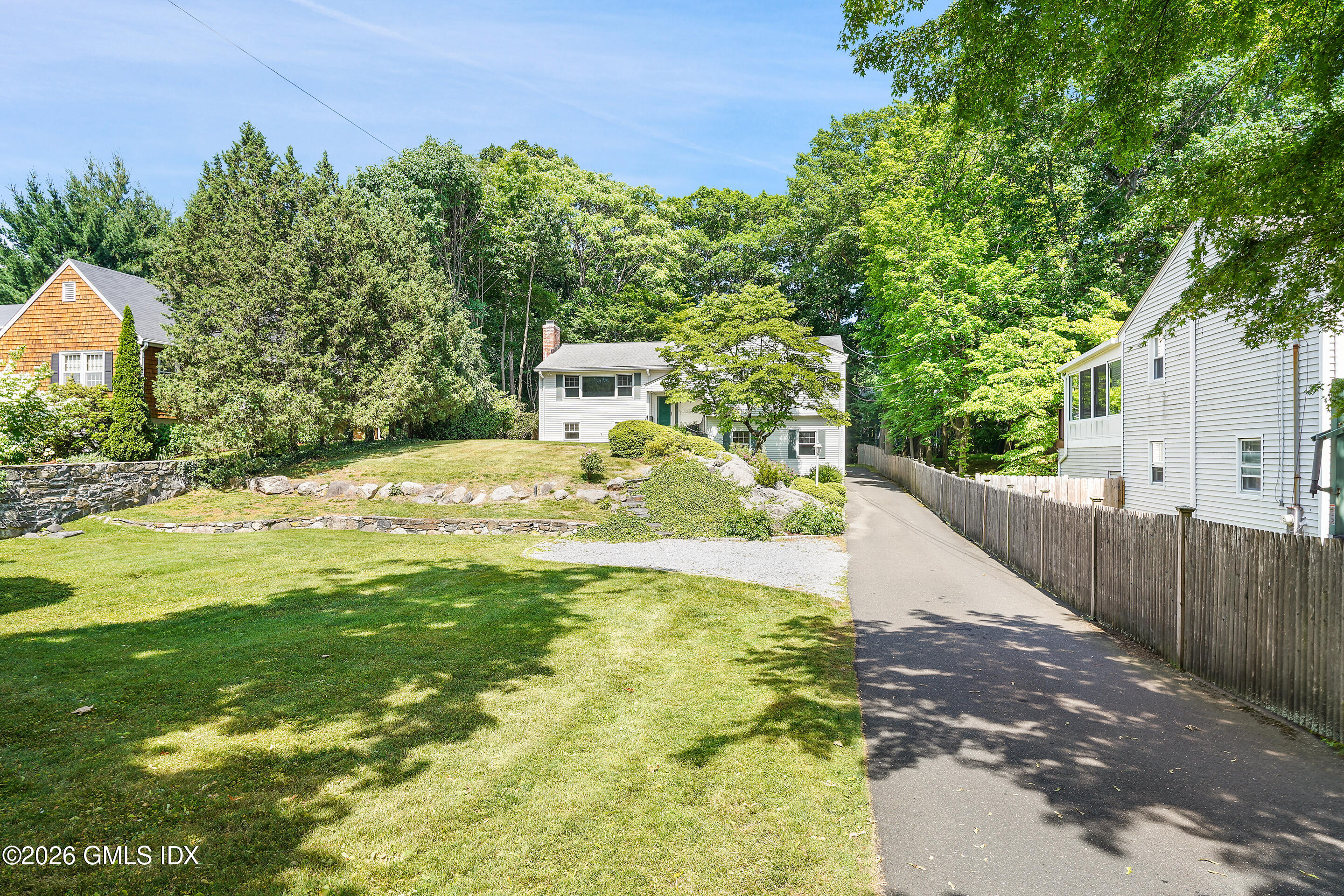 33 Sachem Road Greenwich, CT 06830 - Photo 33 of 35 a bathroom with a sink and a yard
