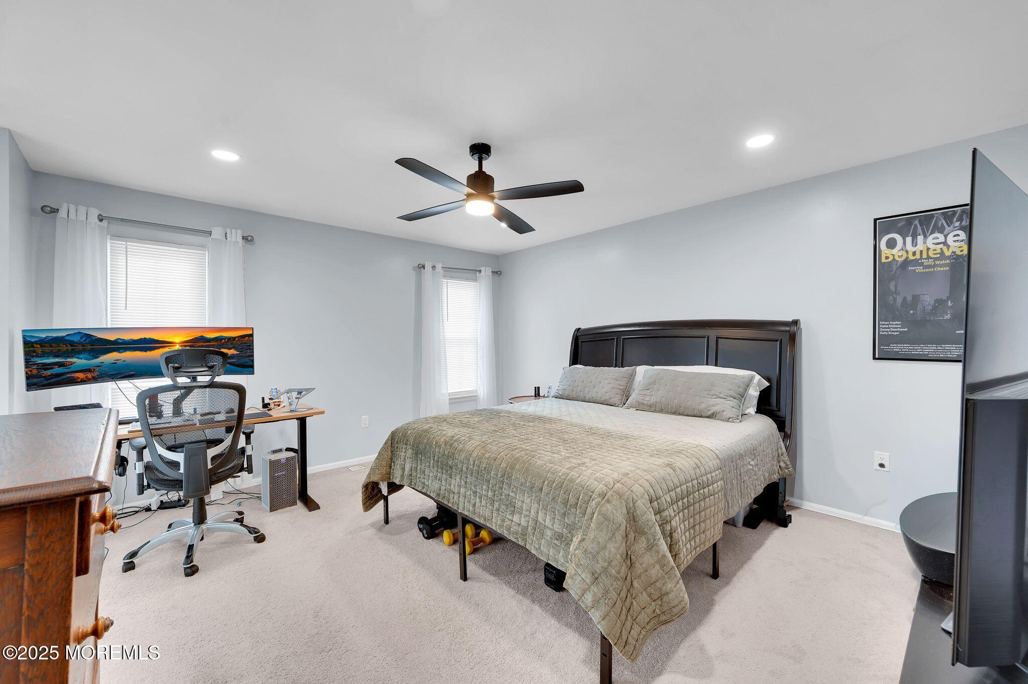 33 South Pointe Circle Tinton Falls, NJ 07753 - Photo 15 of 31 a bedroom with a bed and a chandelier