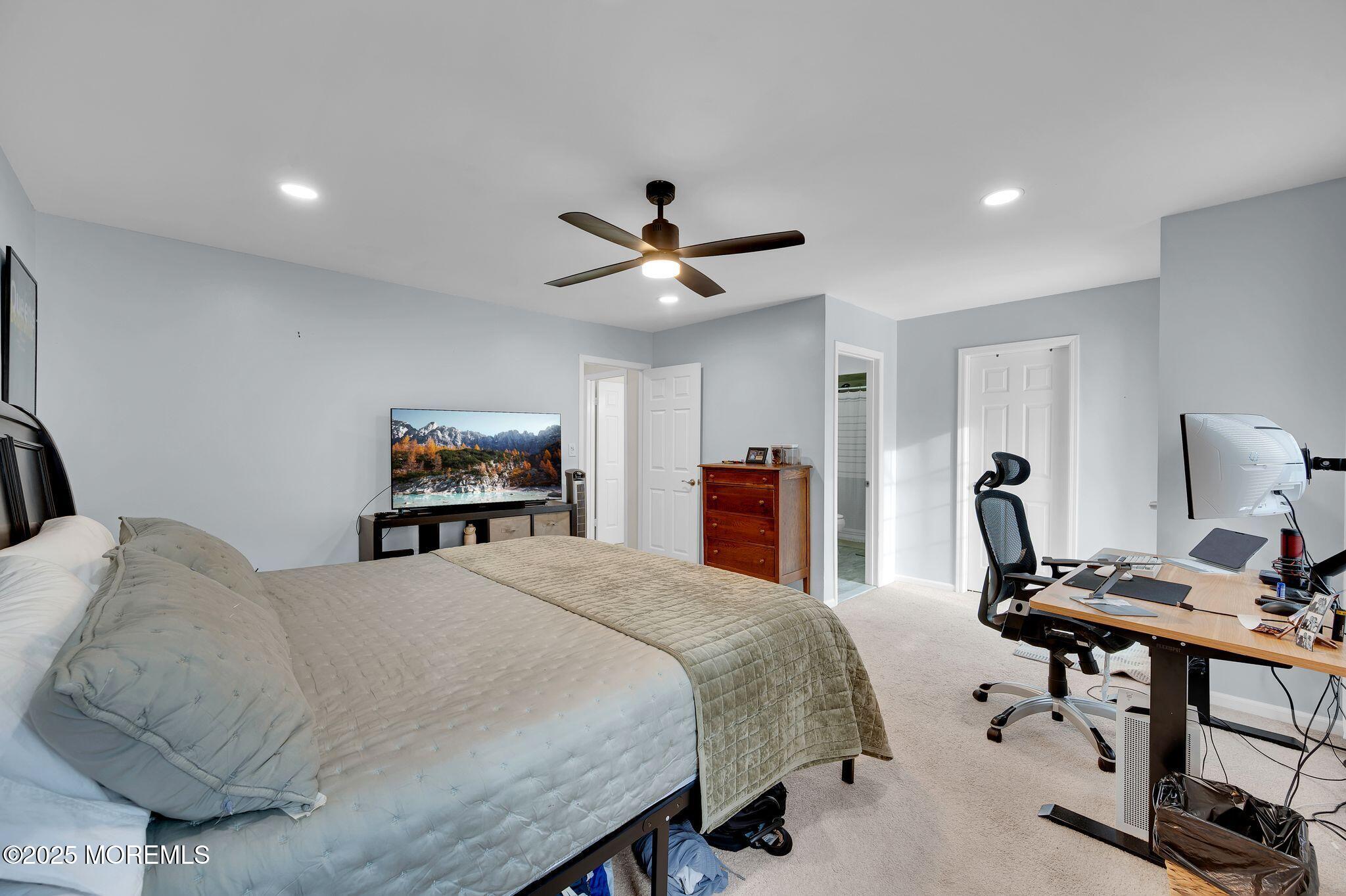 33 South Pointe Circle Tinton Falls, NJ 07753 - Photo 16 of 31 a bedroom with a bed desk and a window