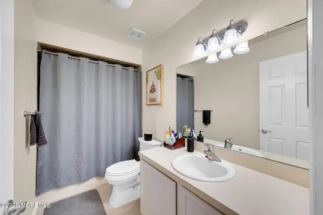 a children room with toys and a flat screen tv