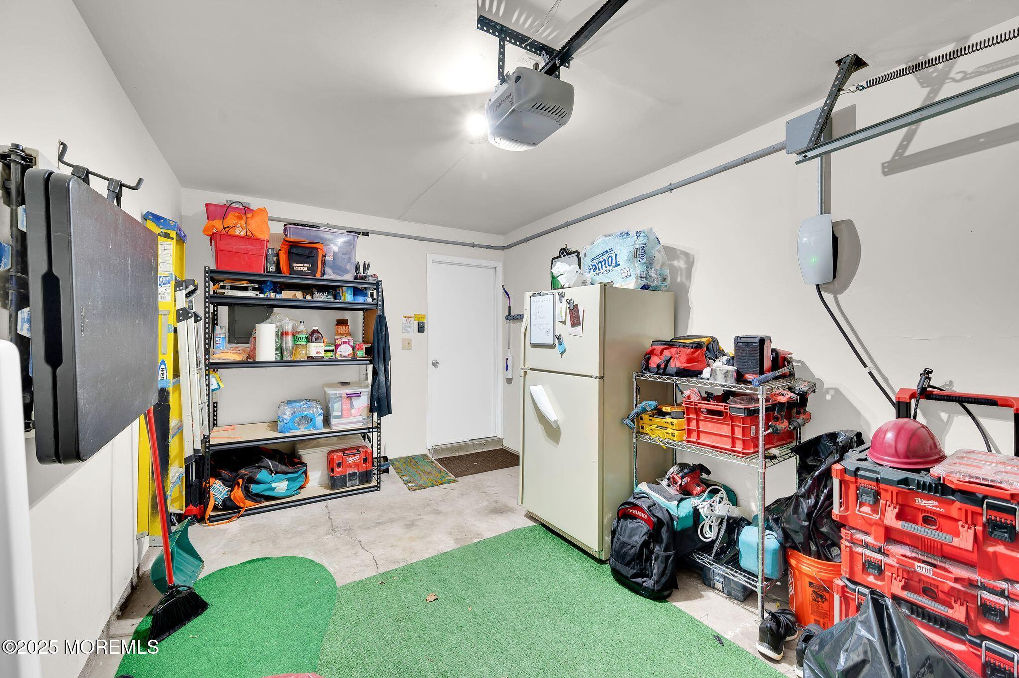 33 South Pointe Circle Tinton Falls, NJ 07753 - Photo 22 of 31 a children room with toys and a flat screen tv