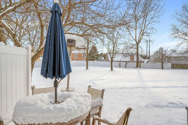 a view of a building with a snow on the road