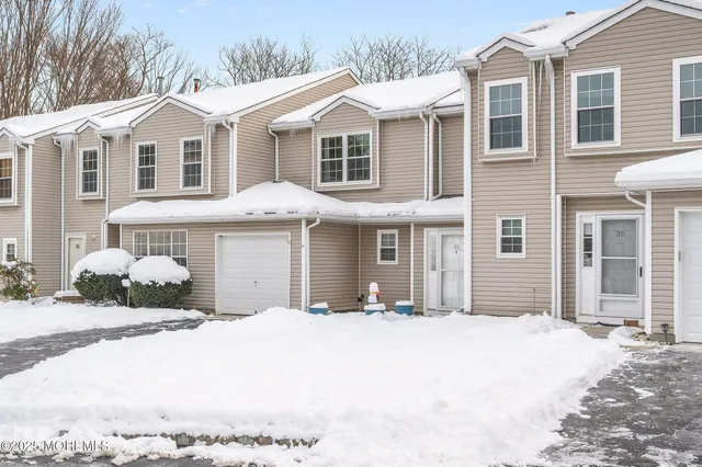 a front view of a house with a outdoor space