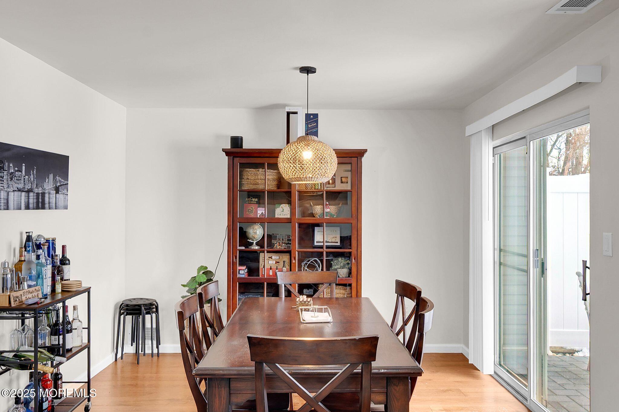 33 South Pointe Circle Tinton Falls, NJ 07753 - Photo 7 of 31 a view of a dining room with furniture window and wooden floor