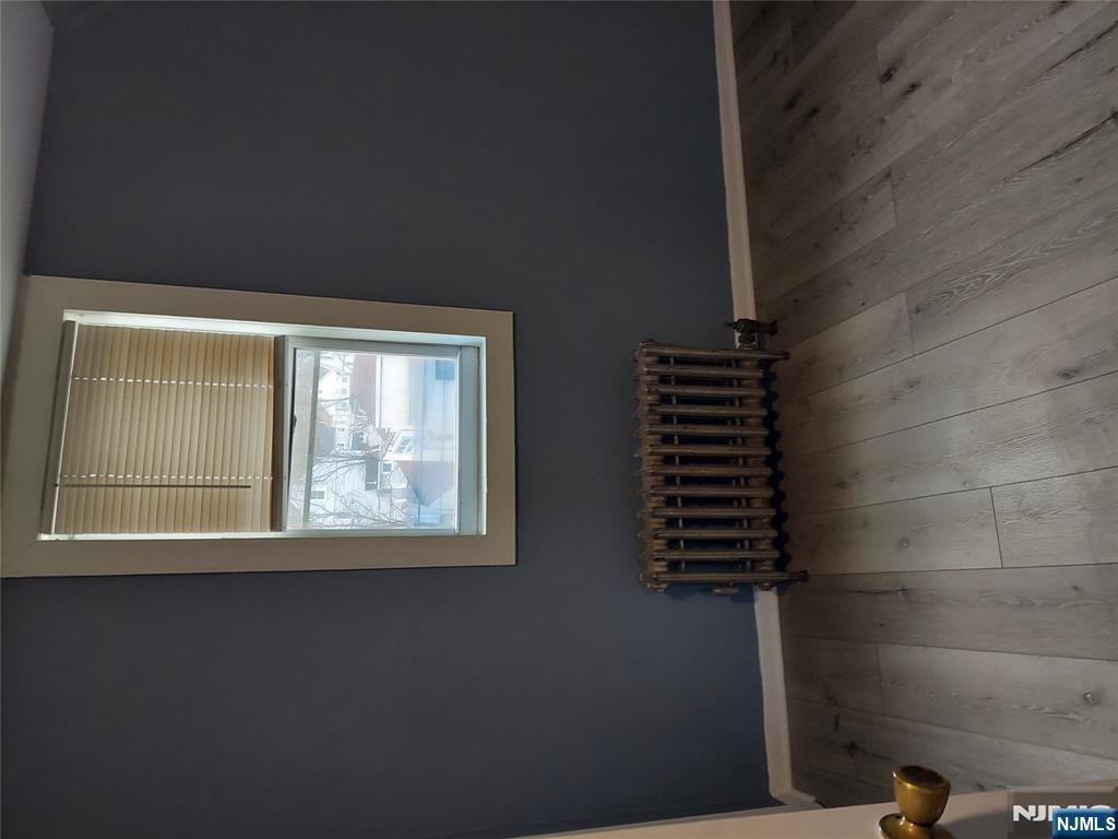 64 East Madison Avenue, Unit #2 Dumont, NJ 07628 - Photo 10 of 14 an empty room with windows