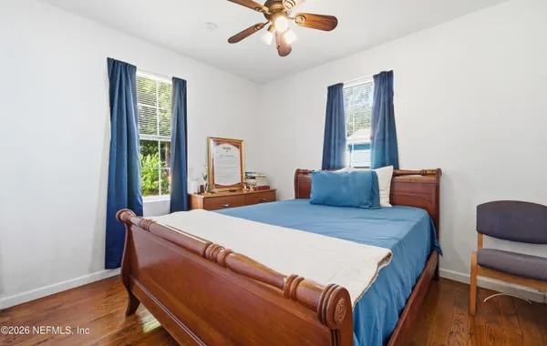 a bed room with a bed and a window