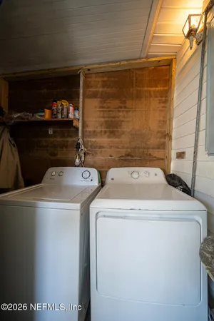 a utility room with dryer and washer