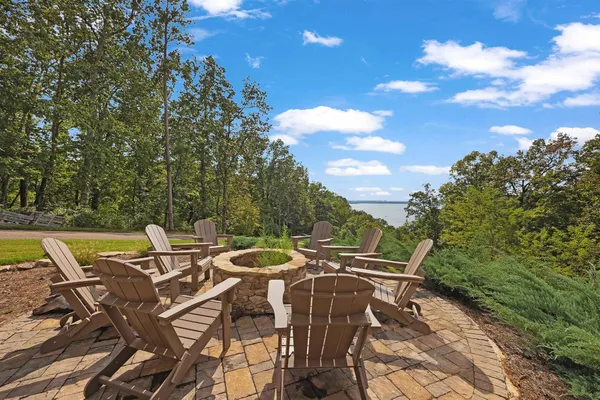 a view of a patio with table and chairs and couches