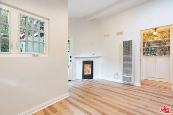 a view of balcony with wooden floor and fence