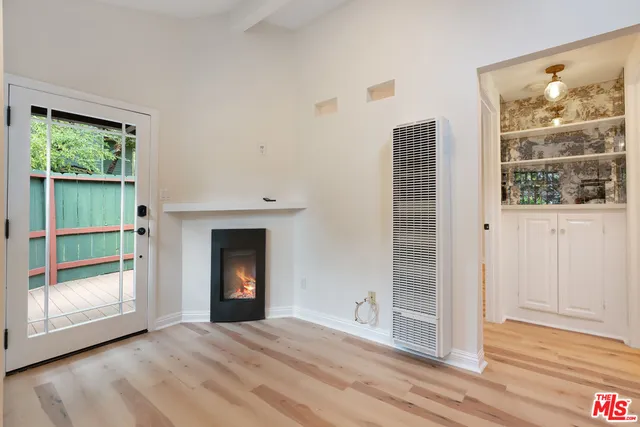 a kitchen with stainless steel appliances granite countertop a refrigerator a stove a sink and a microwave