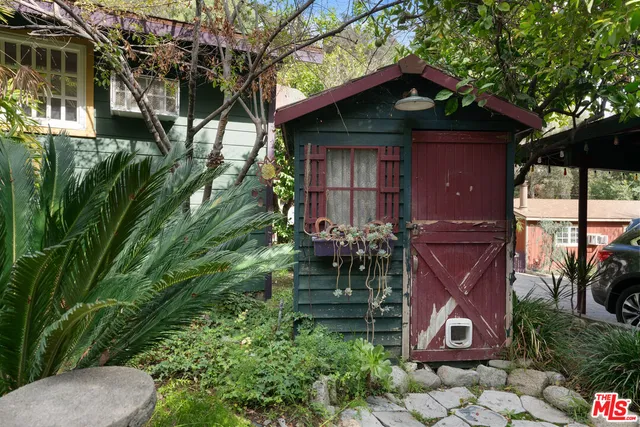 a kitchen with stainless steel appliances white cabinets and a stove top oven