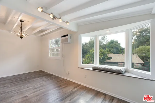 a kitchen with stainless steel appliances a refrigerator stove microwave and cabinets