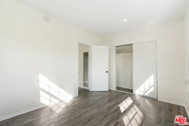 a view of wooden floor in an empty room
