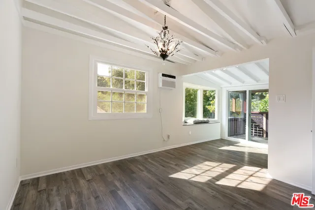 a bathroom with a sink a mirror and toilet