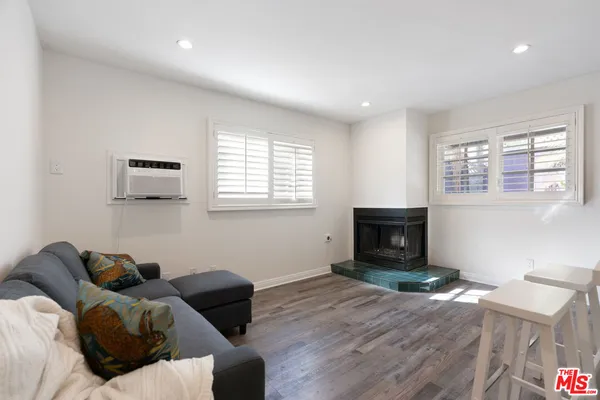 an empty room with wooden floor