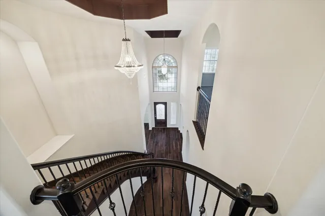 a view of a hallway with a front door