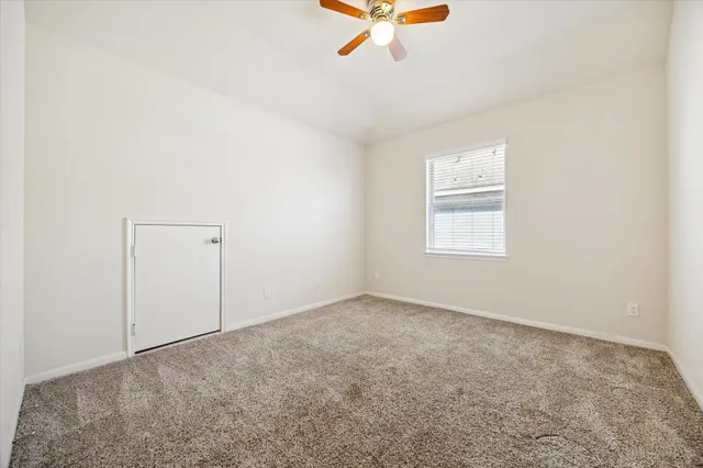 an empty room with fan