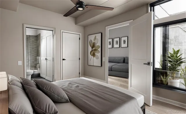 a bedroom with a large bed and a couch