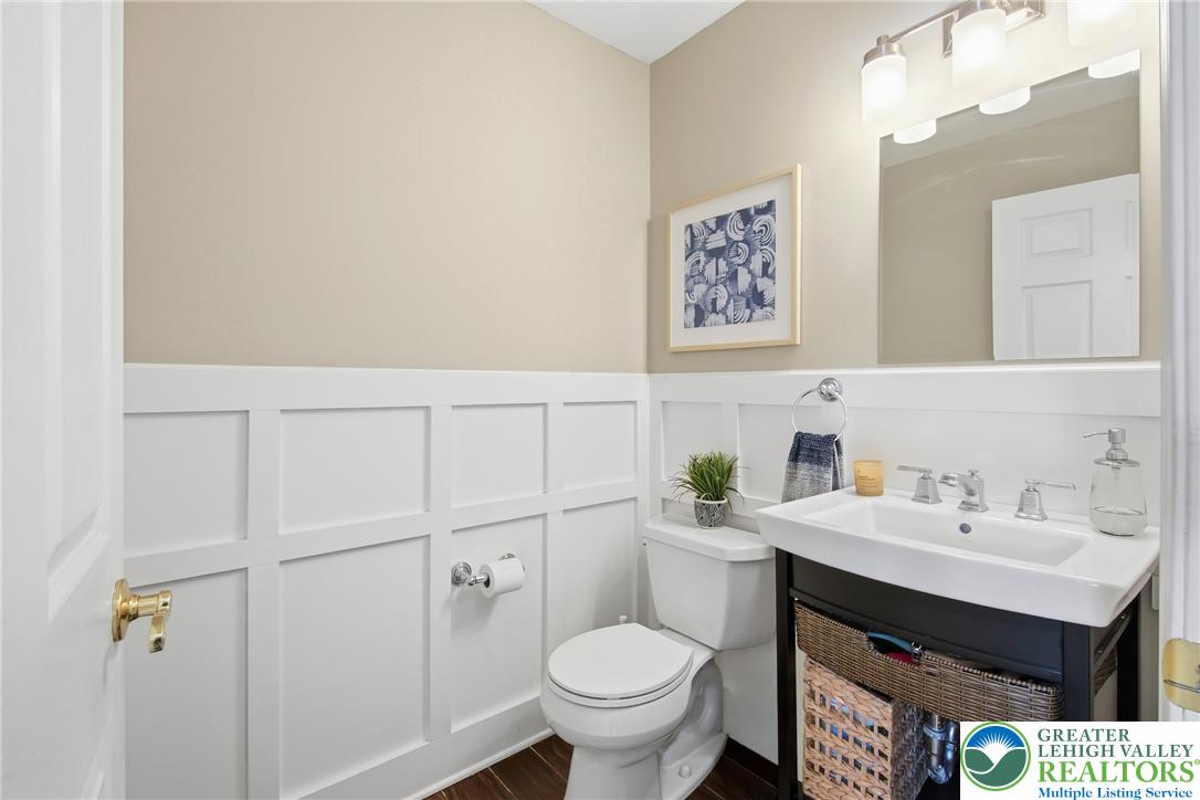 115 West Butternut Road Hellertown, PA 18055 - Photo 30 of 97 Bright powder room with rich wood flooring and crisp wainscoting.